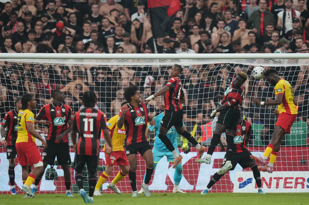 Lens' Odsonne Edouard, right, scores a goal during the French Cup soccer final between Nice and Lens in Saint-Denis, outside Paris, Friday, May 22, 2026. (AP Photo/Thibault Camus)