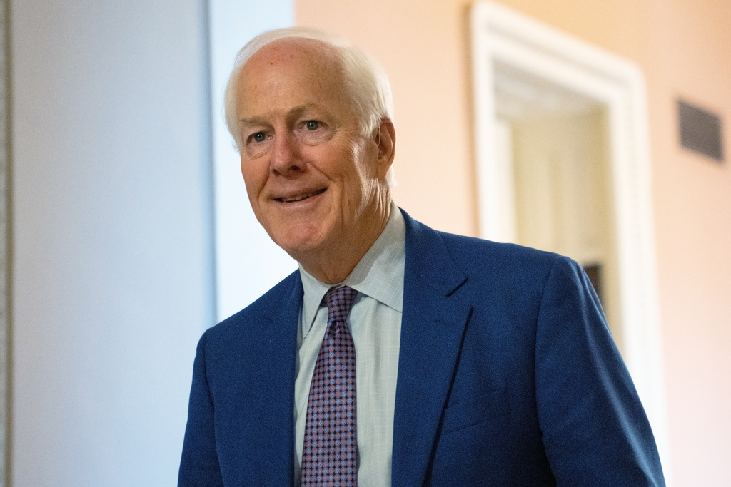 Sen. John Cornyn, R-Texas, walks through the Capitol, Thursday, Jan. 15, 2026, in Washington. (AP Photo/Allison Robbert)
