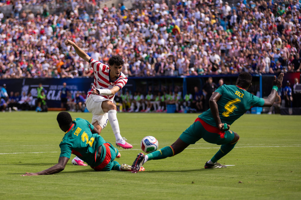 United States forward Ricardo Pepi, top left, has a shot blocked by Senegal defender Abdoulaye Seck (4) during the first half of an international friendly soccer match Sunday, May 31, 2026, in Charlotte, N.C. (AP Photo/Scott Kinser)