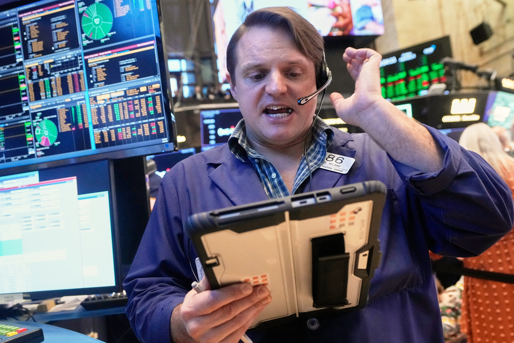 Trader Michael Milano works on the floor of the New York Stock Exchange, Friday, Feb. 6, 2026. (AP Photo/Richard Drew)