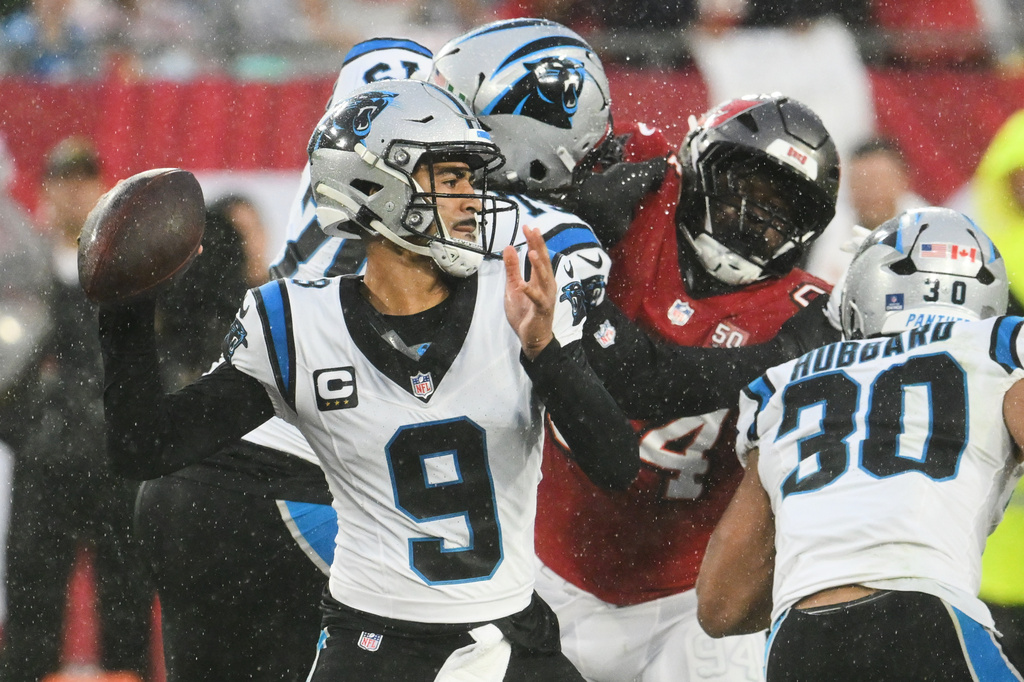 Carolina Panthers quarterback Bryce Young (9) throws under pressure during the first half of an NFL football game against the Tampa Bay Buccaneers Saturday, Jan. 3, 2026, in Tampa, Fla. (AP Photo/Jason Behnken)