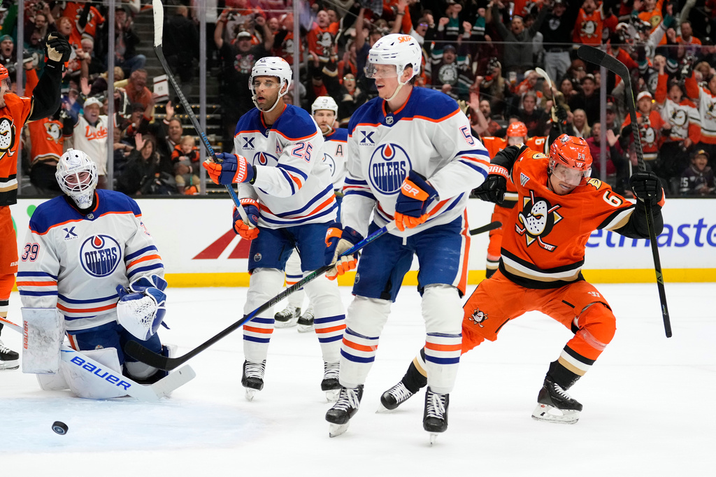 Anaheim Ducks center Mikael Granlund, right, celebrates his goal as Edmonton Oilers goaltender Connor Ingram, left, reacts during the first period of Game 3 in the first round of the NHL hockey Stanley Cup playoffs Friday, April 24, 2026, in Anaheim, Calif. (AP Photo/Mark J. Terrill)