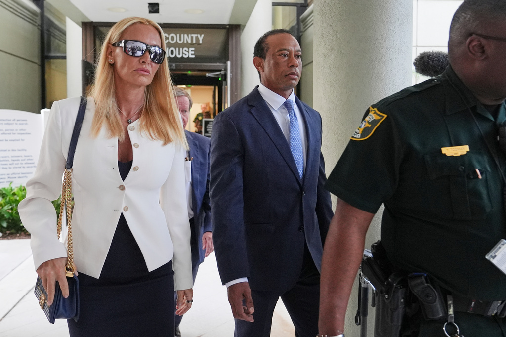 Golfer Tiger Woods, right, leaves with Vanessa Trump, left, after Woods' plea conference hearing in a DUI case stemming from a rollover crash in Florida in March, Wednesday, Sept. 2, 2026, in Stuart, Fla. (AP Photo/Lynne Sladky)