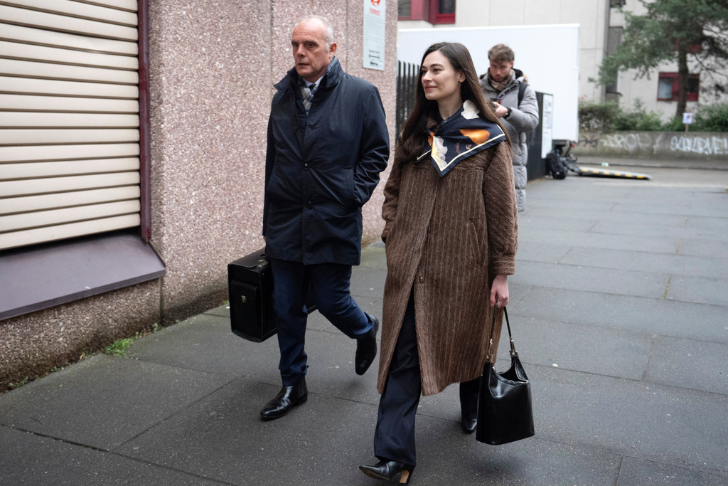 Sanija Ameti, right, a Swiss politician, arrives with her lawyer for her trial at the Zurich District Court, Wednesday, January 28, 2026, in Zurich, Switzerland. (Claudio Thoma/Keystone via AP)