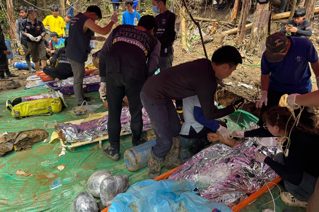 This image provided by the Association Of Volunteers For Lao People, shows rescuers after they safely evacuated the villagers, who had been trapped in a cave in Xaisomboun province, Laos, Saturday, May 30 , 2026. (Association Of Volunteers For Lao People via AP)