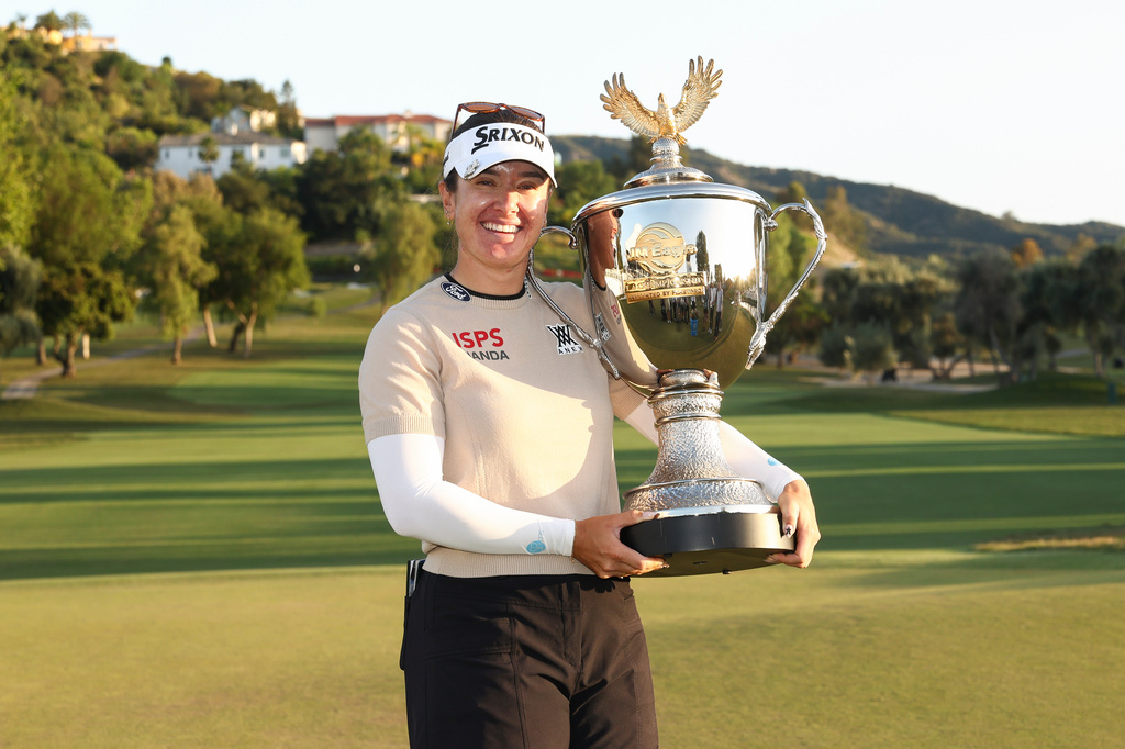 Hannah Green poses with the trophy after winning the LPGA JM Eagle LA Championship golf tournament at El Caballero Country Club Sunday, April 19, 2026, in Los Angeles. (AP Photo/Jessie Alcheh)