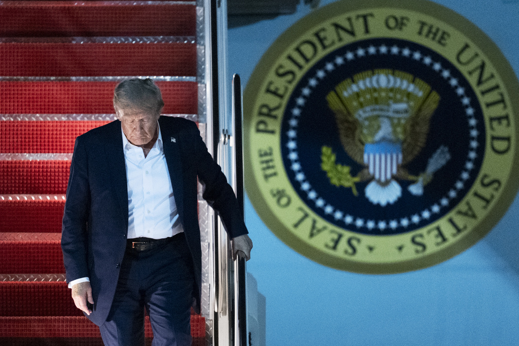 President Donald Trump disembarks Air Force One as he arrives at Joint Base Andrews, Md., early Saturday, Aug. 16, 2025, from a summit with Russian President Vladimir Putin in Anchorage, Alaska. (AP Photo/Manuel Balce Ceneta)