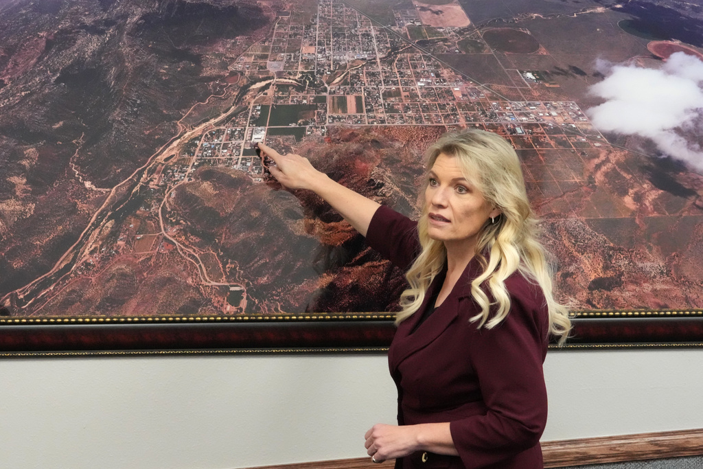 Hildale Mayor Donia Jessop points to an aerial photograph of Hildale during an interview Thursday, Dec. 4, 2025, in Hildale, Ut. (AP Photo/Rick Bowmer)
