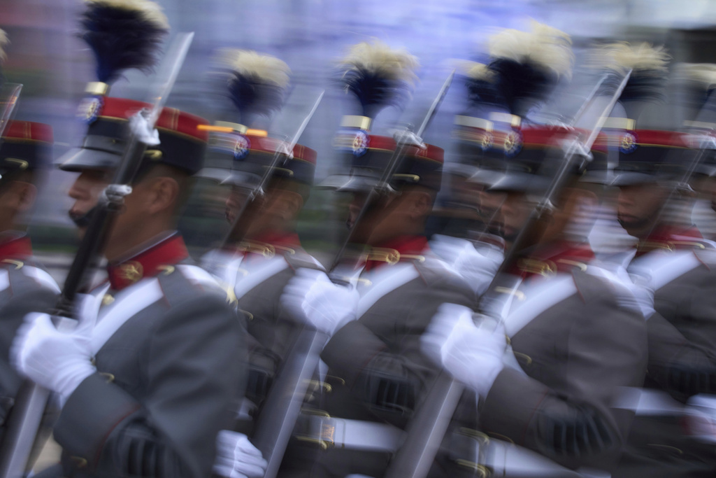 Army cadets escort a Guatemalan flag at Constitution Plaza during a celebration marking Central America's 204th anniversary of independence from Spain, a day before Independence Day in Guatemala City, Sunday, Sept. 14, 2025. (AP Photo/Moises Castillo)
