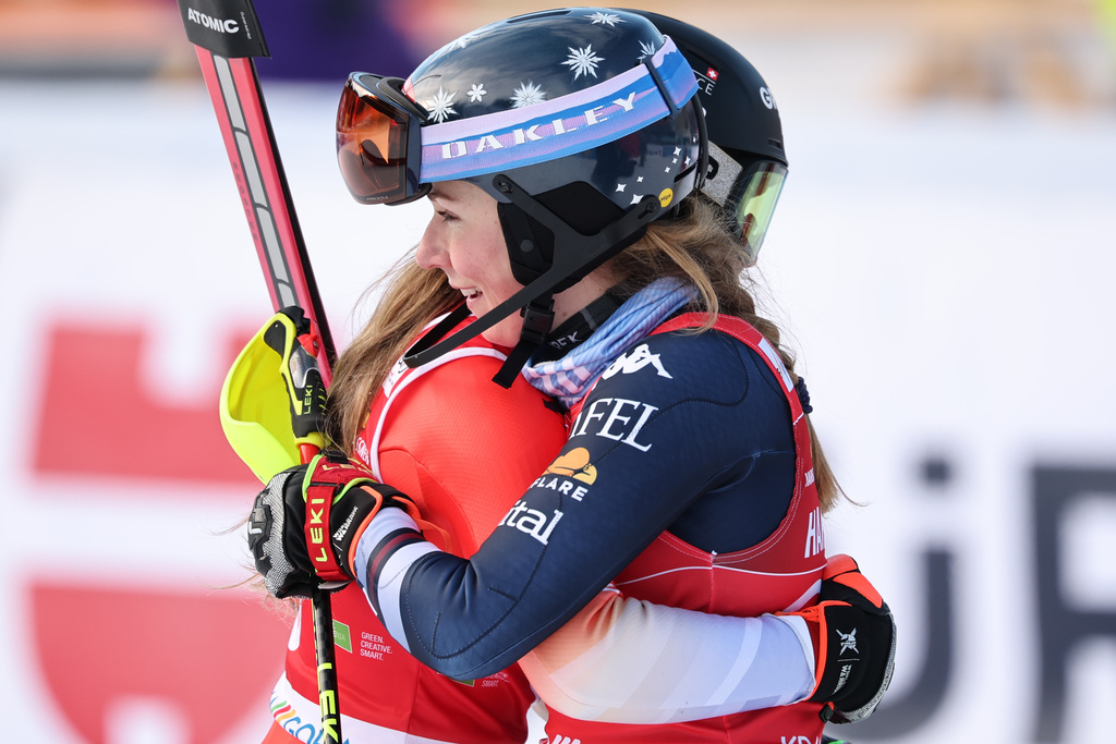 Switzerland's Camille Rast, left, winner of an alpine ski, women's World Cup slalom, is congratulated by second placed United States' Mikaela Shiffrin, in Kranjska Gora, Slovenia, Sunday, Jan. 4, 2026. (AP Photo/Marco Trovati)