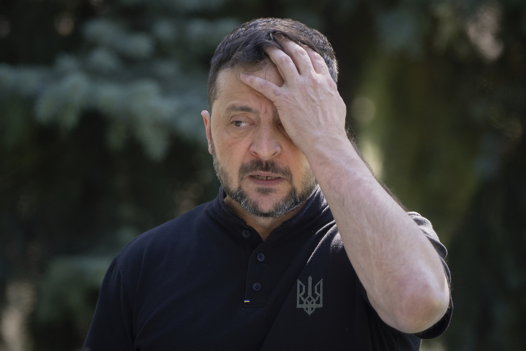 Ukrainian President Volodymyr Zelenskyy reacts during his press conference in Kyiv, Ukraine, Friday, Aug. 29, 2025. (AP Photo/Efrem Lukatsky)