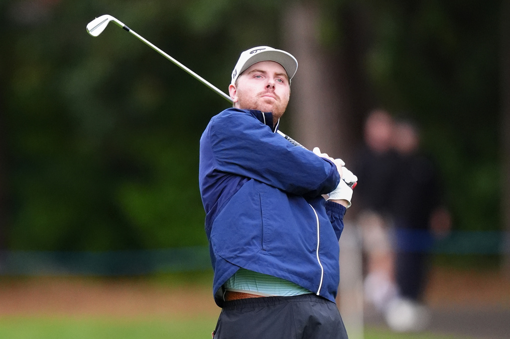 Ryan Gerard, of United States, watches his shot during the first round of the PGA Championship golf tournament in Virginia Water, England, Thursday, Sept. 17, 2026. (Adam Davy/PA via AP)