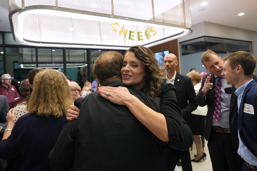 U.S. Senate candidate Rep. Julia Letlow, R-La., hugs a supporter after speaking during an election night watch party Saturday, May 16, 2026, in Baton Rouge, La. (AP Photo/Matthew Hinton)