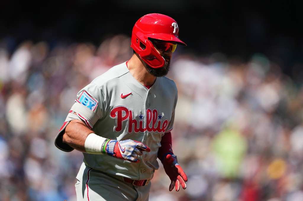 Philadelphia Phillies' Kyle Schwarber jogs the bases after hitting a three-run home run against Seattle Mariners starting pitcher Bryan Woo during the second inning of a baseball game, Wednesday, Aug. 26, 2026, in Seattle. (AP Photo/Lindsey Wasson)