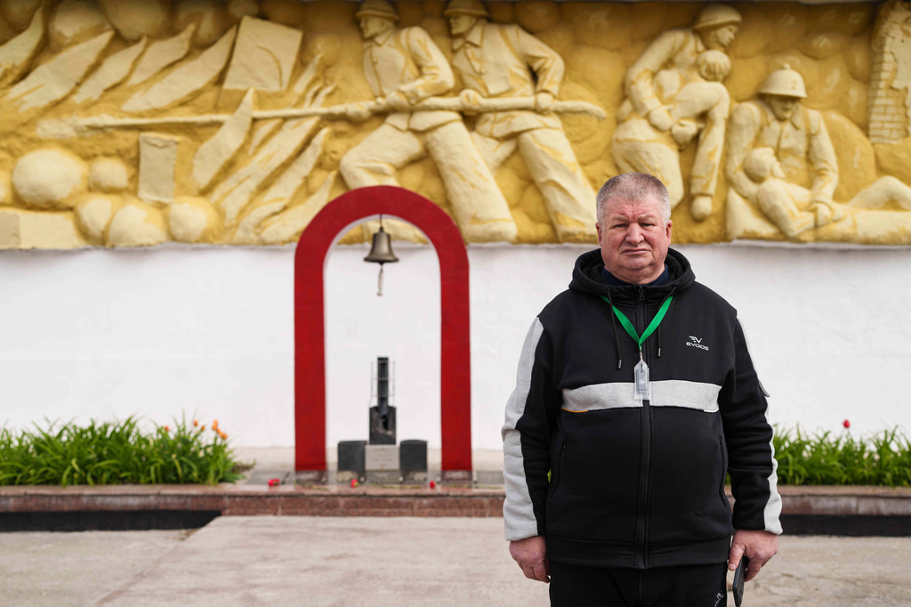 Mykola Chudak, 66, poses for a portrait at a fire department where he served for six months in 1986-87 working within 10 kilometers (6 miles) of the Chernobyl nuclear power plant in Chernobyl, Ukraine, Tuesday, April 21, 2026. (AP Photo/Evgeniy Maloletka)