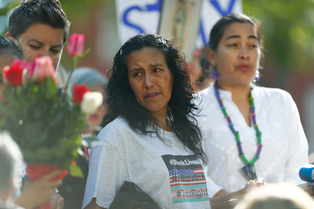 FILE - Jeanette Vizguerra, center, a Mexican immigrant who has lived in a church to avoid immigration authorities for the past three months, pauses as she speaks after leaving the church early May 12, 2017, in downtown Denver. (AP Photo/David Zalubowski, File)