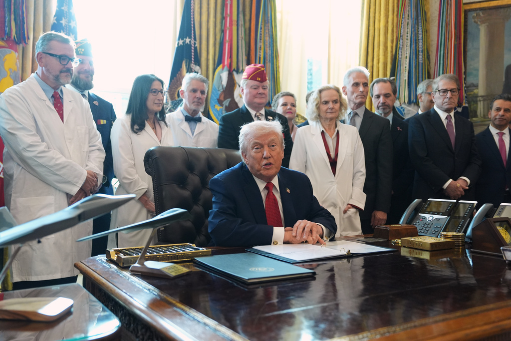 President Donald Trump speaks during an executive order signing in the Oval Office of the White House, Thursday, Dec. 18, 2025, in Washington. (AP Photo/Evan Vucci)