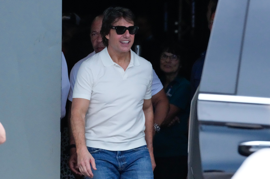 Actor Tom Crusie exits the building after attending a drivers meeting before a NASCAR Cup Series auto race at Daytona International Speedway, Saturday, Aug. 29, 2026, in Daytona Beach, Fla. (AP Photo/John Raoux)