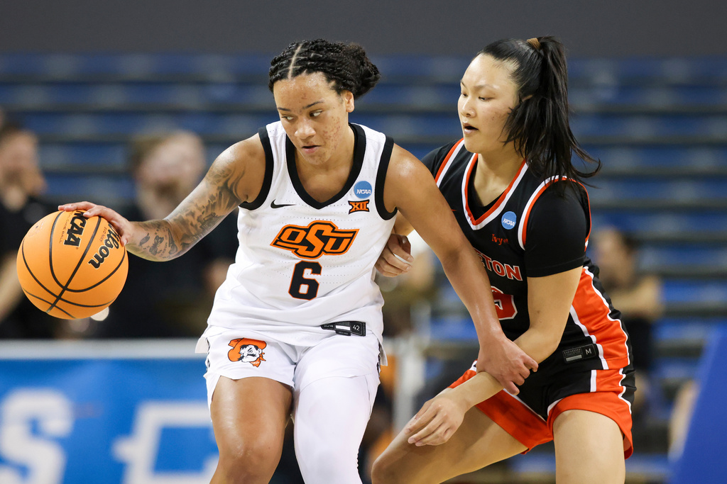 Oklahoma State guard Jadyn Wooten (6) dribbles against Princeton guard Ashley Chea, right, during the second half in the first round of the NCAA college basketball tournament, Saturday, March 21, 2026, in Los Angeles. (AP Photo/Jessie Alcheh)