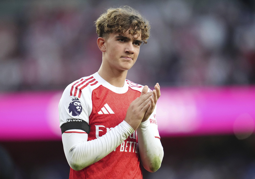 Arsenal's Max Dowman acknowledges the fans after the English Premier League soccer match between Arsenal and Leeds United at Emirates stadium in London, England, Saturday, Aug. 23, 2025. (John Walton/PA via AP)