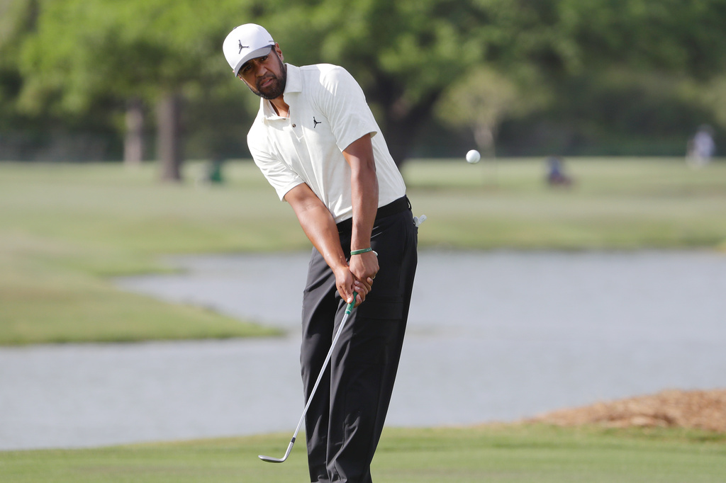 Tony Finau hits onto the 17th green during the first round of the Texas Children's Houston Open golf tournament Thursday, March 26, 2026, in Houston. (AP Photo/Michael Wyke)