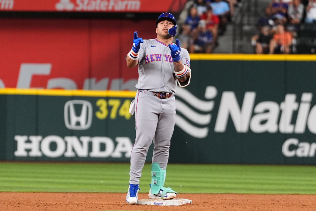 New York Mets' Francisco Alvarez celebrates his two-run double in the sixth inning of a baseball game against the Texas Rangers Tuesday, Sept. 22, 2026, in Arlington, Texas. (AP Photo/Tony Gutierrez)