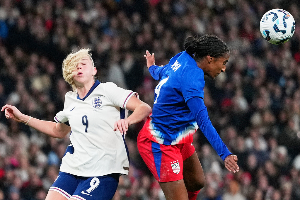 FILE - England's Alessia Russo and United States' Naomi Girma challenge for the ball during the International friendly women soccer match between England and United States at Wembley stadium in London, Nov. 30, 2024. (AP Photo/Kirsty Wigglesworth, File)