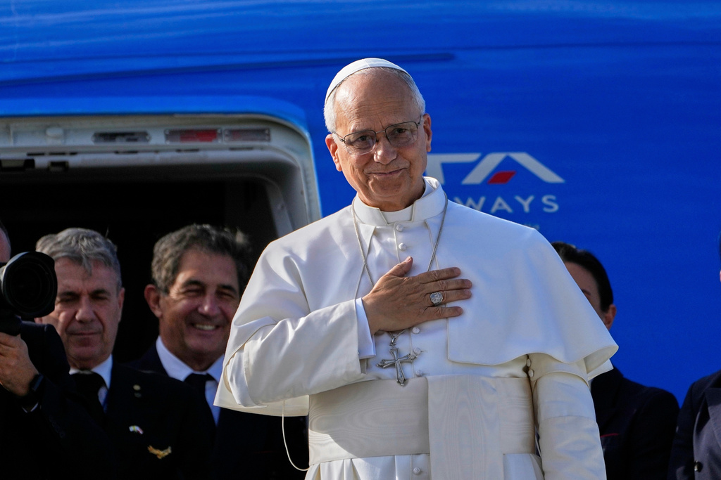 FILE - Pope Leo XIV gestures as he boards a flight back to the Vatican, in Beirut, Lebanon, on Dec. 2, 2025. (AP Photo/Hussein Malla, File)