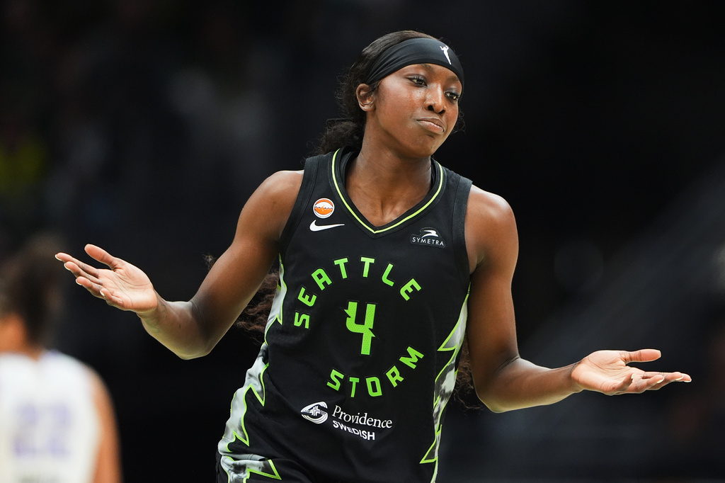 Seattle Storm guard Flau'jae Johnson reacts after making a three-point basket against the Golden State Valkyries during the first half of a WNBA basketball game, Friday, May 8, 2026, in Seattle. (AP Photo/Lindsey Wasson)