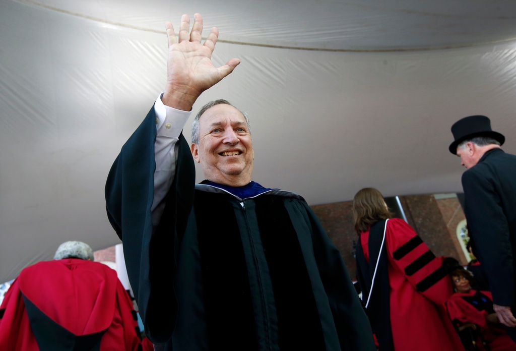 FILE -Former Harvard University president Larry Summers waves during Harvard commencement exercises, May 24, 2018, in Cambridge, Mass. (AP Photo/Michael Dwyer, File)