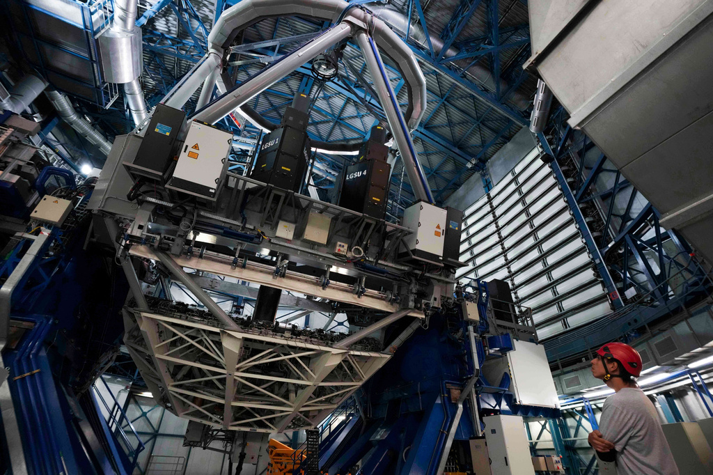 An operator looks at a Very Large Telescope at the Paranal Observatory operated by the European Southern Observatory in the Atacama Desert, Chile, Monday, April 13, 2026. (AP Photo/Esteban Felix)