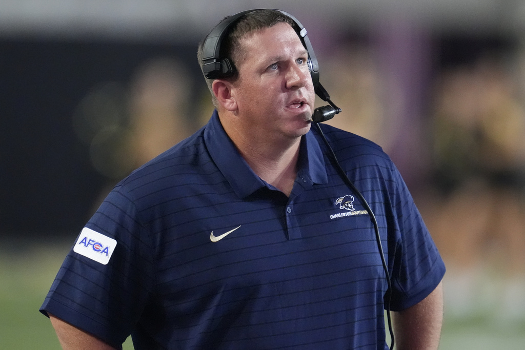 Charleston Southern head coach Gabe Giardina walks the sideline during the second half of an NCAA college football game Saturday, Aug. 30, 2025, in Nashville, Tenn. (AP Photo/George Walker IV)