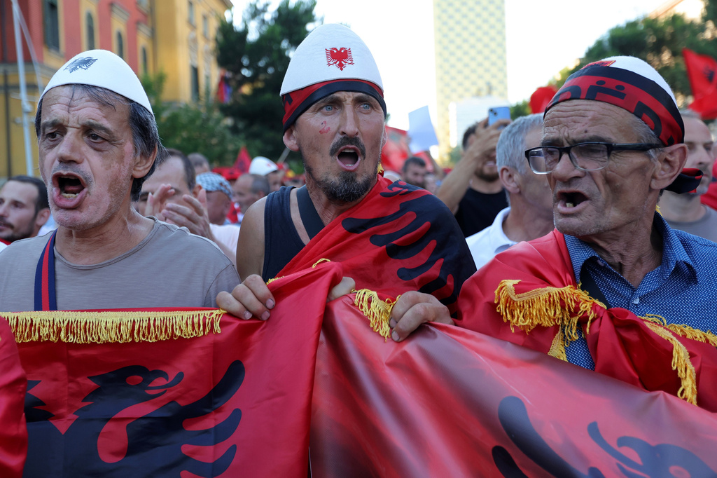 Protesters chant slogans during a rally against plans for a luxury construction project linked to U.S. President Donald Trump's son-in-law, Jared Kushner, in Tirana, Albania, Saturday, July 4, 2026.(AP Photo/Hameraldi Agolli)