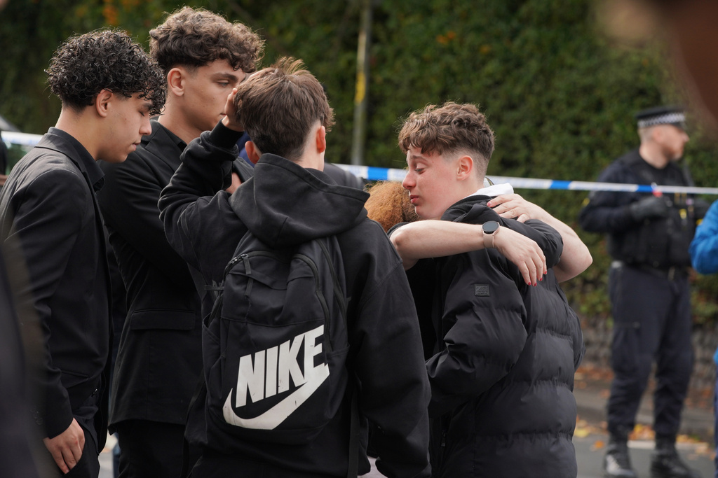People react close to the scene of a stabbing incident at Heaton Park Hebrew Congregation synagogue, in Crumpsall, Manchester, England, Thursday, Oct. 2, 2025. (AP Photo/Ian Hodgson)