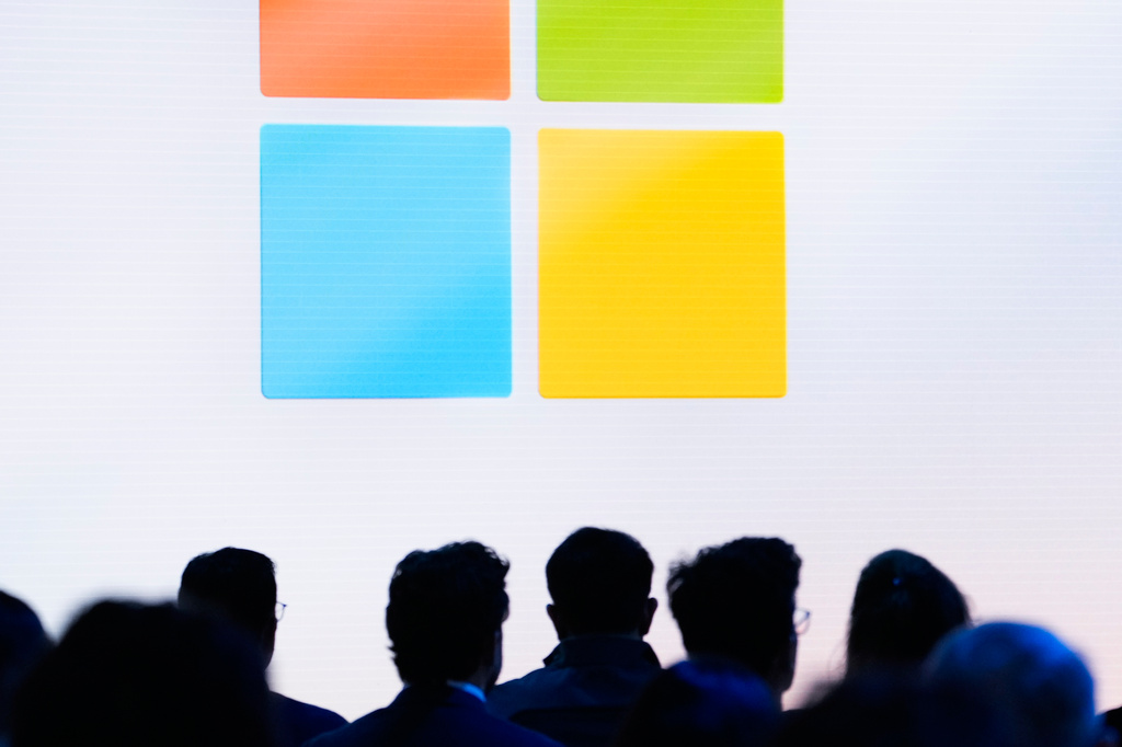 FILE - People attend a showcase event of the company's AI assistant, Copilot, ahead of the annual Build developer conference at Microsoft headquarters, Monday, May 20, 2024, in Redmond, Wash. (AP Photo/Lindsey Wasson, File)