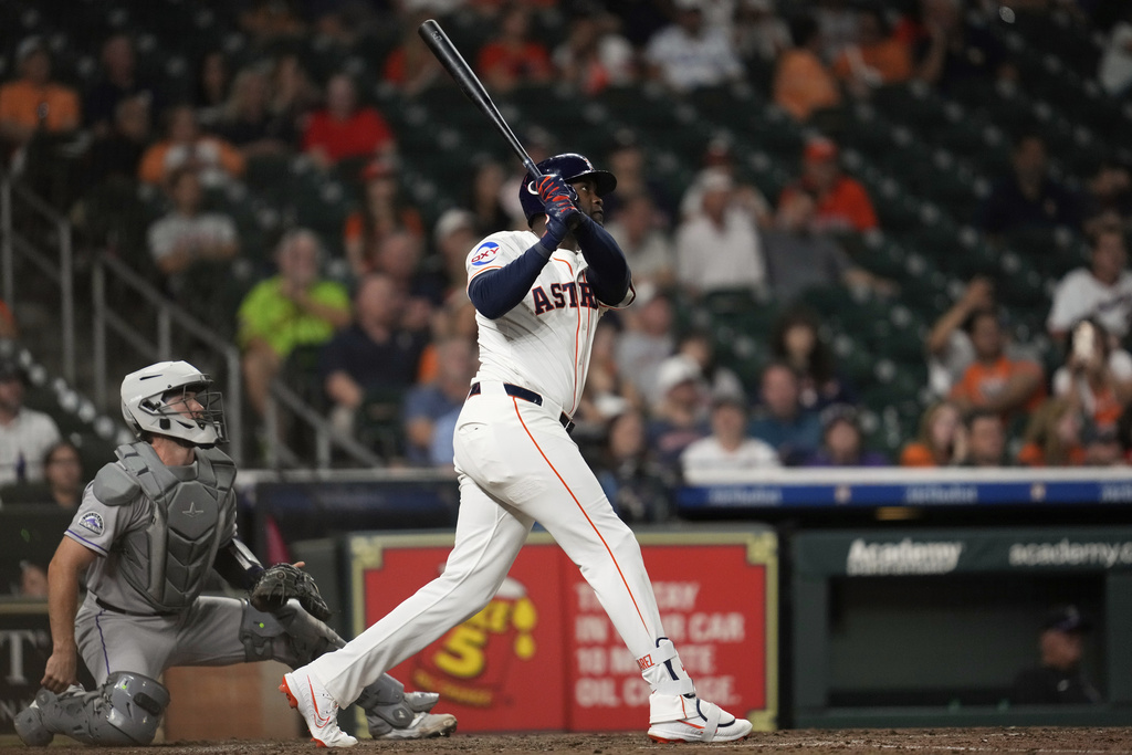 Houston Astros designated hitter Yordan Alvarez hits a home run during the eighth inning of a baseball game against the Colorado Rockies in Houston, Wednesday, Aug. 27, 2025. Jeremy Peña also scored. (AP Photo/Ashley Landis)
