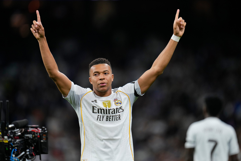 Real Madrid's Kylian Mbappe celebrates after scoring the opening goal during the Spanish La Liga soccer match between Real Madrid and Valencia in Madrid, Spain, Saturday, Nov. 1, 2025. (AP Photo/Manu Fernandez)