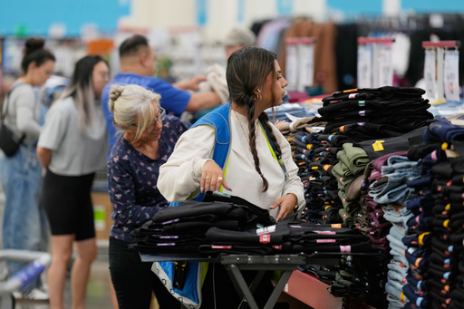 A worker stocks a display of clothing at a Sam's Club, Wednesday, Sept. 24, 2025, in Bentonville, Ark. (AP Photo/Charlie Riedel) A worker stocks a display of clothing at a Sam's Club, Wednesday, Sept. 24, 2025, in Bentonville, Ark. (AP Photo/Charlie Riedel)