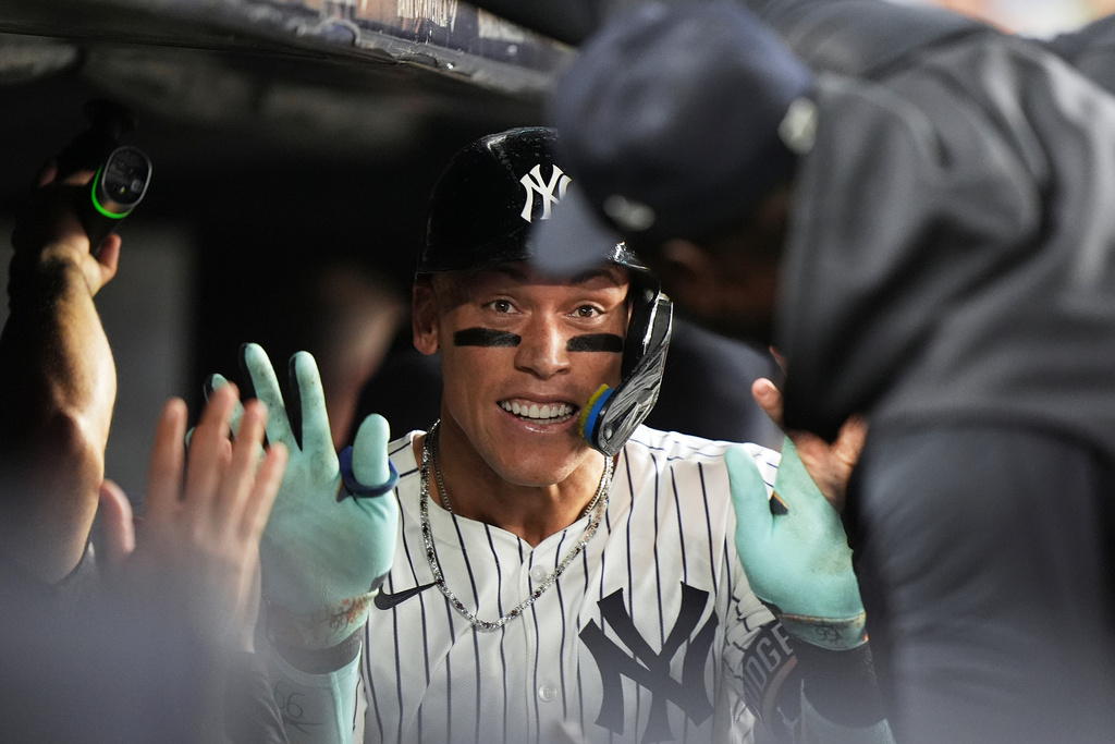 New York Yankees' Aaron Judge celebrates with teammates after hitting a three-run home run during the second inning of a baseball game against the Chicago White Sox Wednesday, Sept. 24, 2025, in New York. (AP Photo/Frank Franklin II)