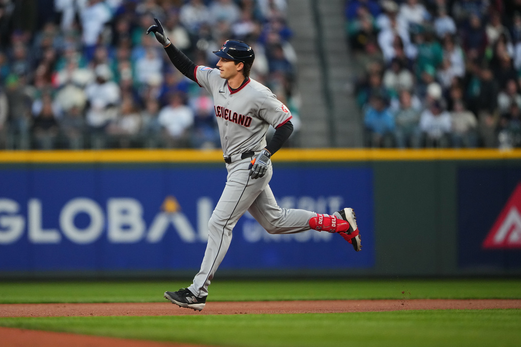 Cleveland Guardians' Chase DeLauter jogs the bases after hitting a solo home run against Seattle Mariners starting pitcher Logan Gilbert during the first inning of an opening-day baseball game, Thursday, March 26, 2026, in Seattle. (AP Photo/Lindsey Wasson)