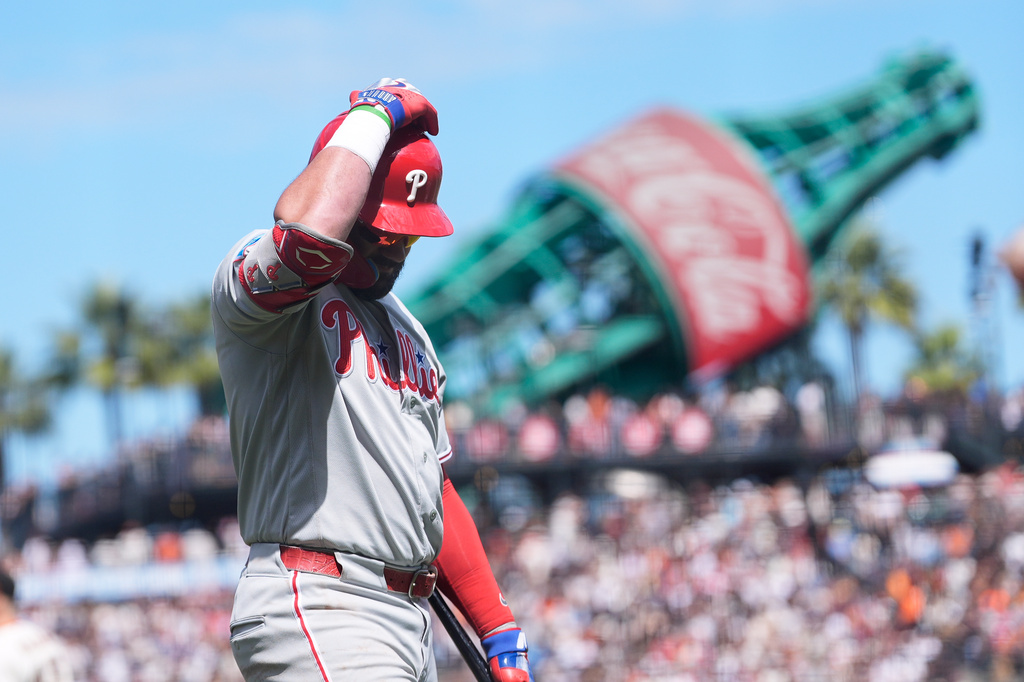 Philadelphia Phillies' Kyle Schwarber walks to the dugout after striking out against the San Francisco Giants during the seventh inning of a baseball game in San Francisco, Wednesday, April 8, 2026. (AP Photo/Jeff Chiu)
