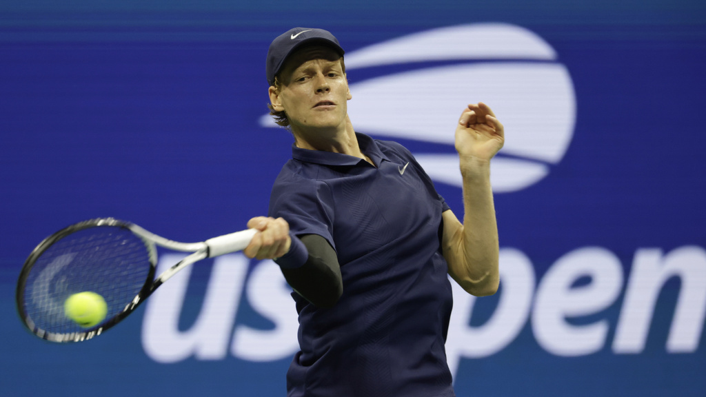 Jannik Sinner, of Italy, returns a shot to Lorenzo Musetti, of Italy, during the quarterfinal round of the U.S. Open tennis championships, Wednesday, Sept. 3, 2025, in New York. (AP Photo/Adam Hunger)