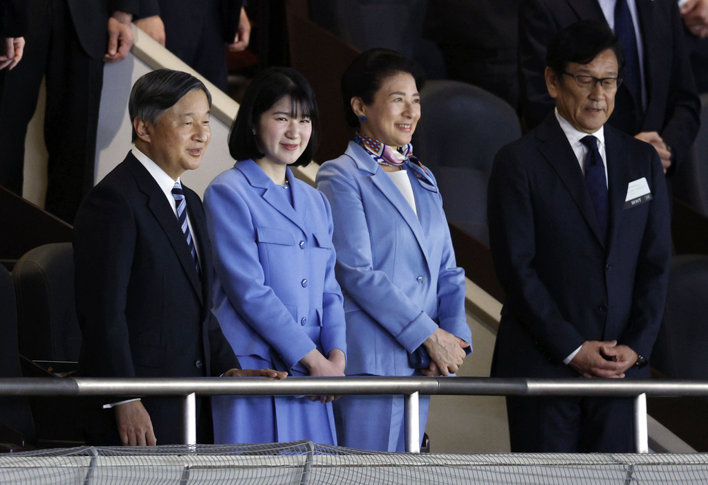 Japan's Emperor Naruhito, Empress Masako, center right, and their daughter Princess Aiko watch a World Baseball Classic game between Japan and Australia, together with Hideki Kuriyama, right, manager of Team Japan that won the 2023 World Baseball Classic championship, in Tokyo Sunday, March 8, 2026. (Suo Gakekuma/Kyodo News via AP)