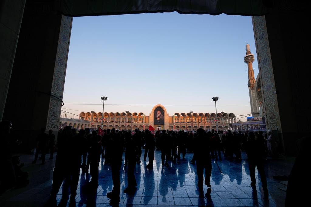 Mourners gather during funeral ceremonies for slain Iranian Supreme Leader Ayatollah Ali Khamenei and members of his family at the Imam Khomeini Mosalla Grand Mosque in Tehran, Iran, Sunday, July 5, 2026. (AP Photo/Altaf Qadri)