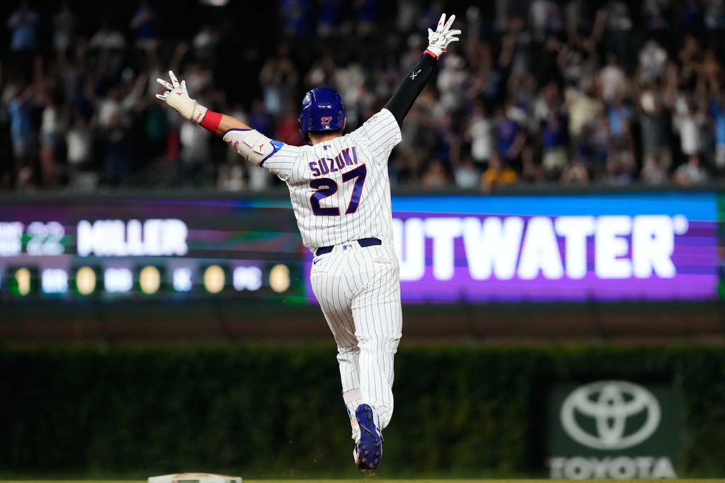 Chicago Cubs' Seiya Suzuki of Japan, celebrates after hitting a walk-off one-run single during the ninth inning of a baseball game against the San Diego Padres in Chicago, Monday, June 29, 2026. (AP Photo/Nam Y. Huh)