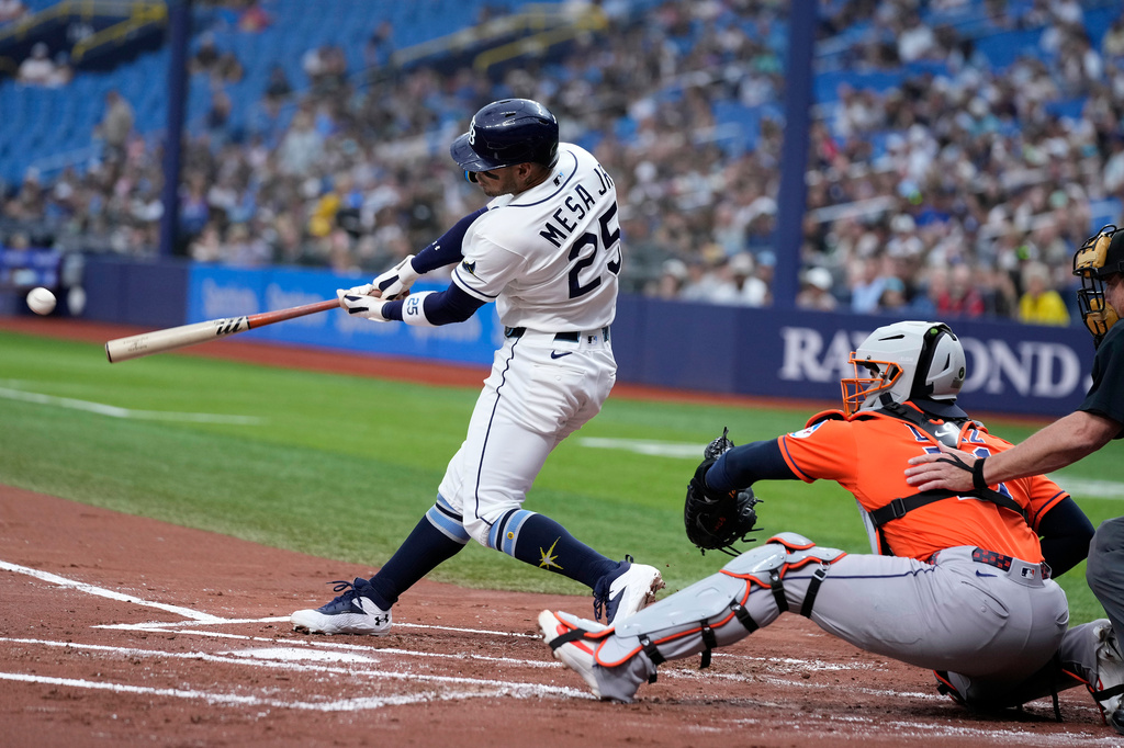 Tampa Bay Rays' Victor Mesa Jr. (25) connects for a two-run triple off Houston Astros pitcher Hayden Wesneski during the first inning of a baseball game Sunday, Sept. 13, 2026, in St. Petersburg, Fla. (AP Photo/Chris O'Meara)