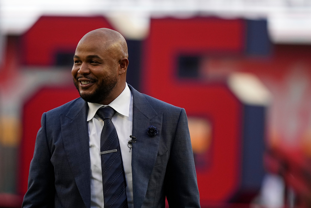 FILE - Former Atlanta Braves player Andruw Jones walks on the field as his number is retired Sept. 9, 2023, in Atlanta. (AP Photo/Brynn Anderson, File)