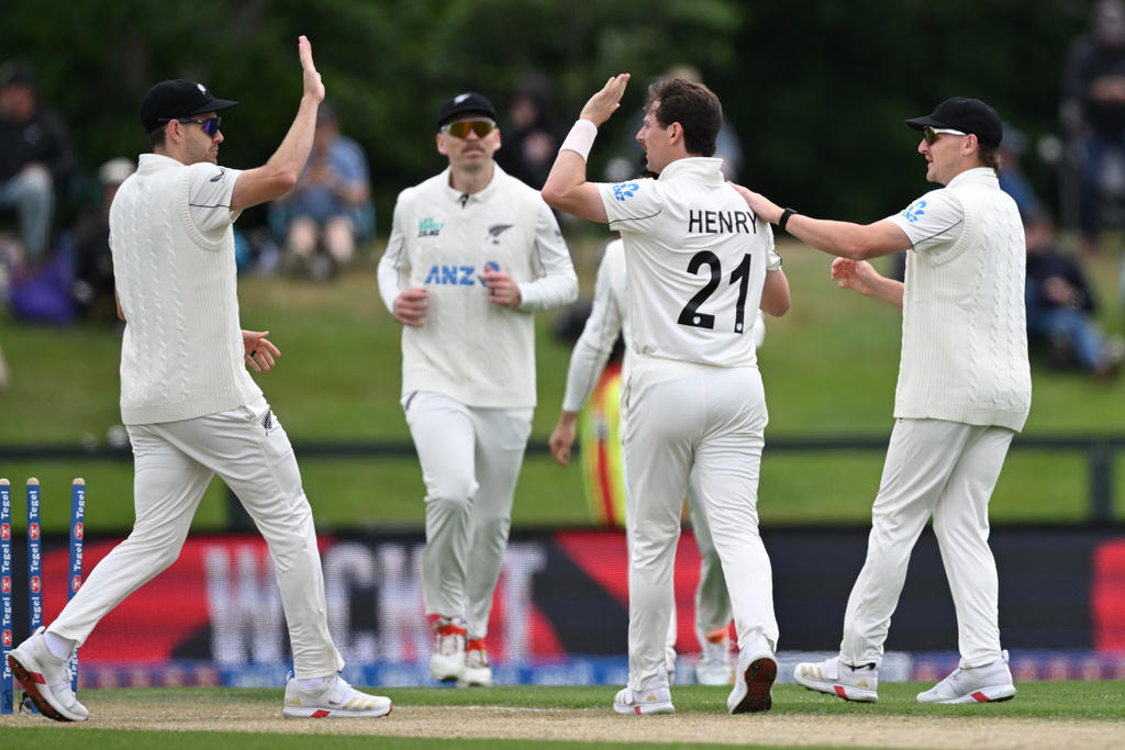 New Zealand bowler Matt Henry, second right, celebrates with teammates after taking the wicket of the West Indies' Alick Athanaze during their cricket test match in Christchurch, New Zealand, Wednesday, Dec. 3, 2025. (Andrew Cornaga/Photosport via AP)