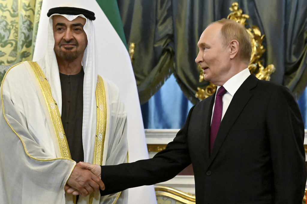 Russian President Vladimir Putin, right, and United Arab Emirates President Sheikh Mohammed bin Zayed Al Nahyan shake hands during their meeting at the Grand Kremlin Palace in Moscow, Russia, Thursday, Aug. 7, 2025. (Alexander Nemenov/Pool Photo via AP)