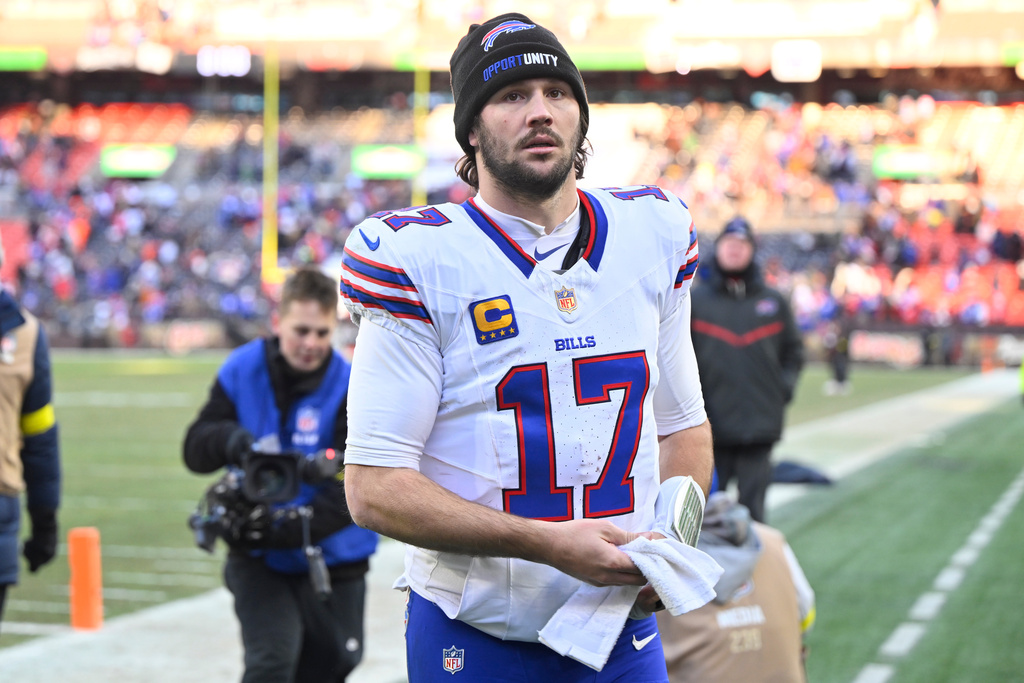 Buffalo Bills quarterback Josh Allen (17) leave the field after an NFL football game against the Cleveland Browns in Cleveland, Sunday, Dec. 21, 2025. (AP Photo/David Richard)